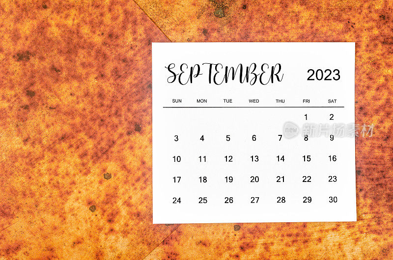 The September 2023 Monthly calendar for 2023 year on red grunge background.